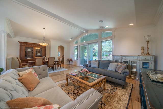 living room featuring vaulted ceiling with beams and light hardwood / wood-style floors