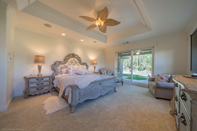 bedroom with light carpet, access to outside, a raised ceiling, and ceiling fan