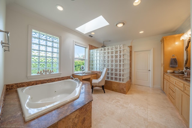 bathroom featuring separate shower and tub, a skylight, vanity, and ornamental molding