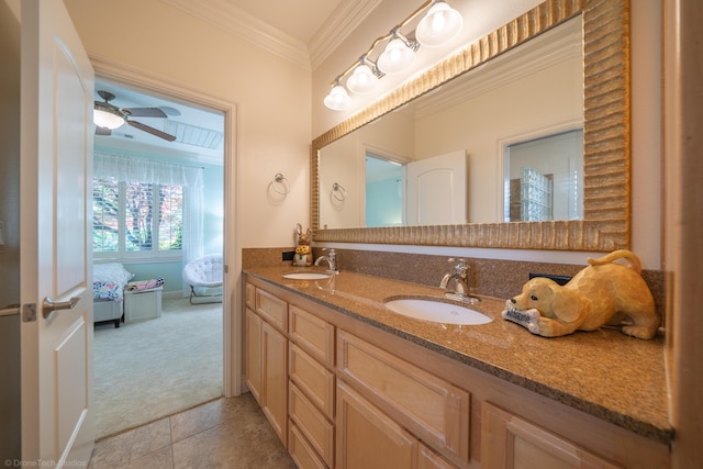 bathroom featuring tile patterned floors, crown molding, vanity, and ceiling fan