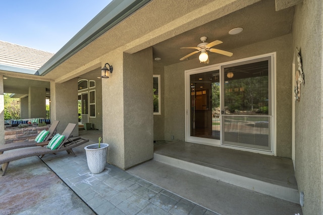 view of patio featuring ceiling fan