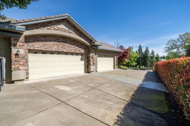 view of property exterior with a garage