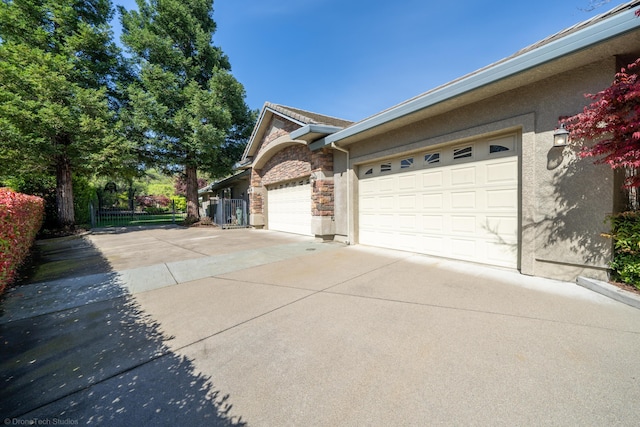 view of side of property with a garage