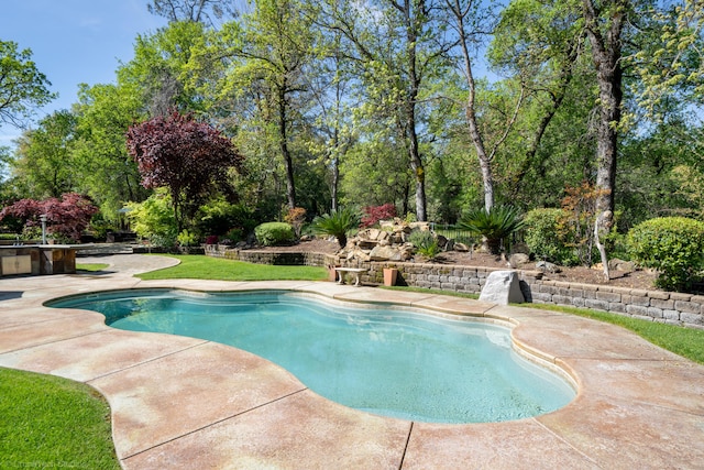 view of swimming pool featuring a patio area