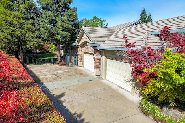 view of property exterior with a garage