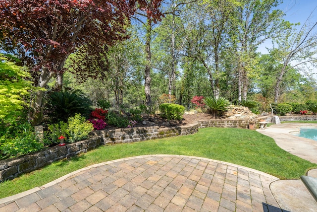 exterior space featuring a patio and a fenced in pool