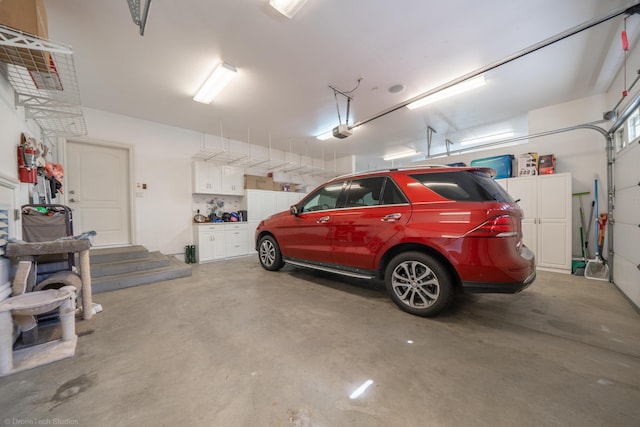 garage featuring a garage door opener