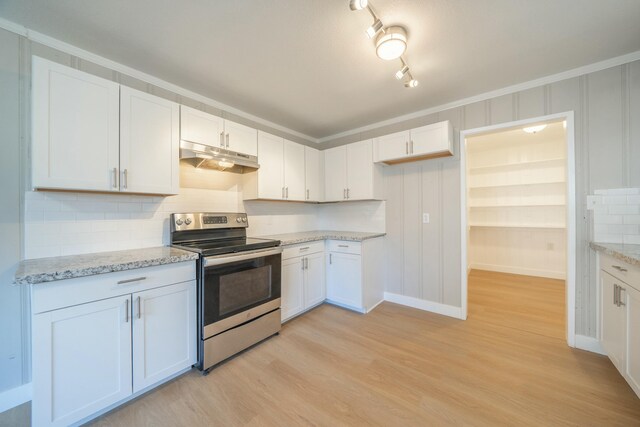 kitchen featuring white cabinetry, tasteful backsplash, and electric range