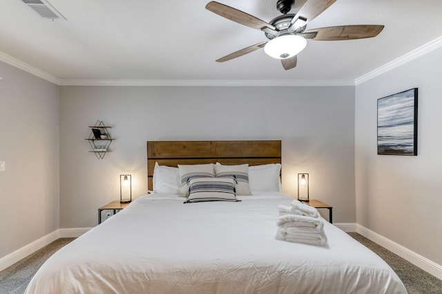 bedroom with ceiling fan, carpet, and ornamental molding