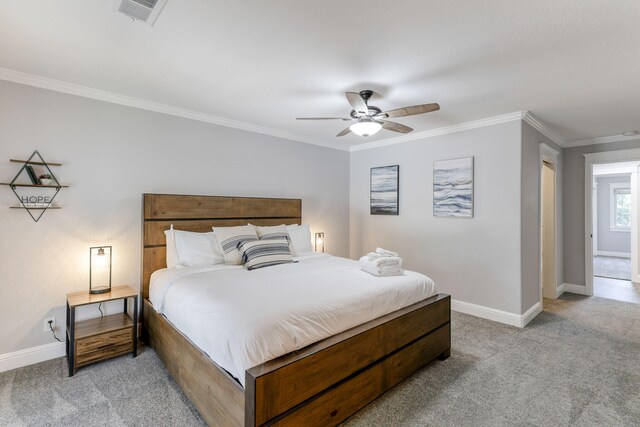 bedroom with ceiling fan, light carpet, and crown molding