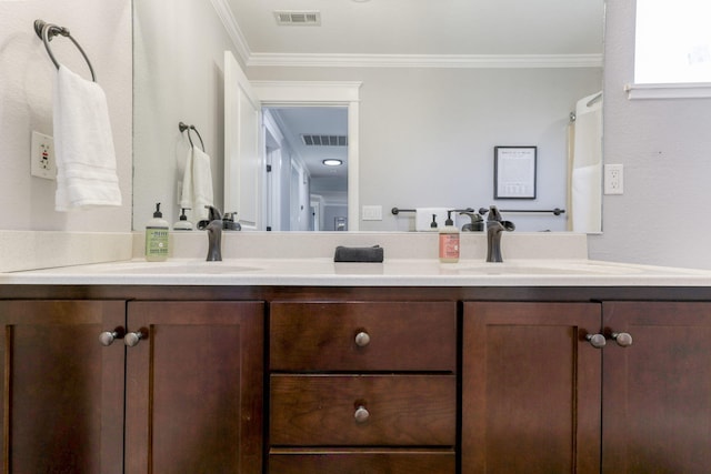 bathroom featuring vanity and ornamental molding