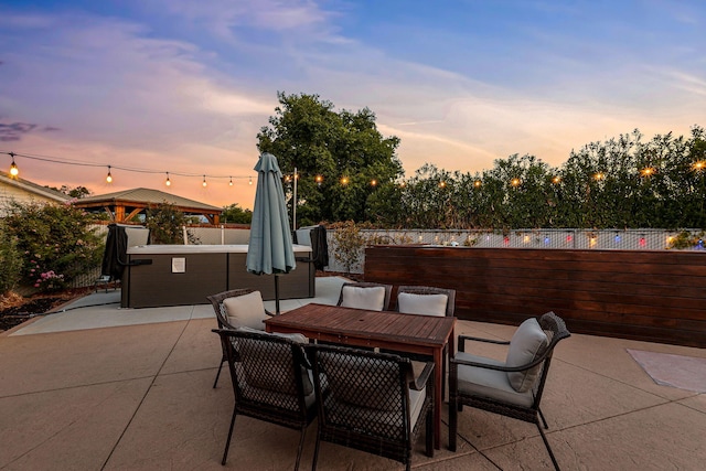 patio terrace at dusk with a gazebo