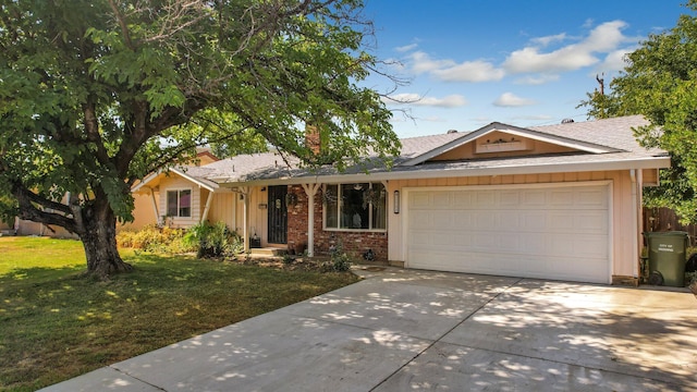 ranch-style home featuring a front yard and a garage