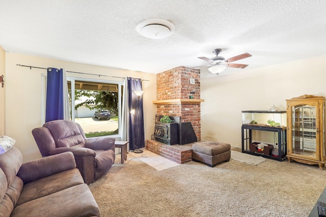 carpeted living room featuring a wood stove, ceiling fan, and a textured ceiling