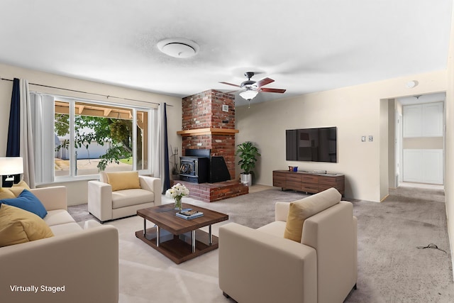 2048 Wilder Dr, Redding, CA 96001 - living area with ceiling fan, light carpet, and a wood stove