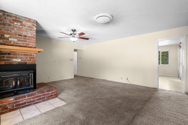 2048 Wilder Dr, Redding, CA 96001 - unfurnished living room with ceiling fan, carpet floors, tile patterned flooring, and a textured ceiling