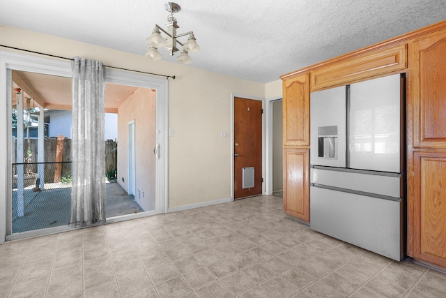 2048 Wilder Dr, Redding, CA 96001 - kitchen with built in refrigerator and a chandelier