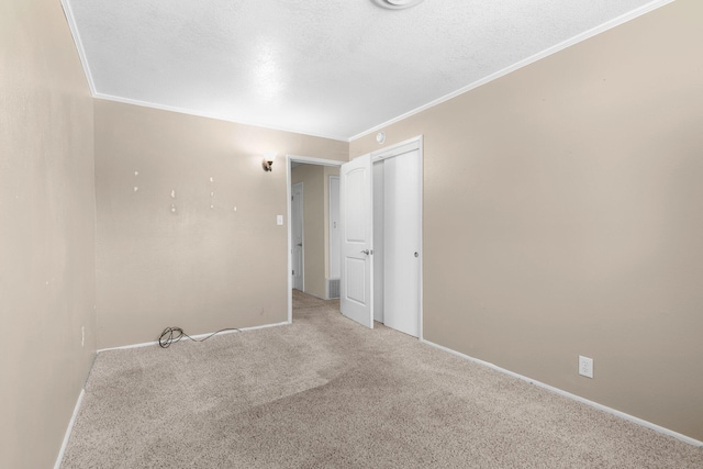 2048 Wilder Dr, Redding, CA 96001 - empty room with carpet flooring, crown molding, and a textured ceiling