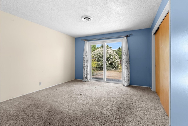 2048 Wilder Dr, Redding, CA 96001 - unfurnished room featuring carpet floors and a textured ceiling