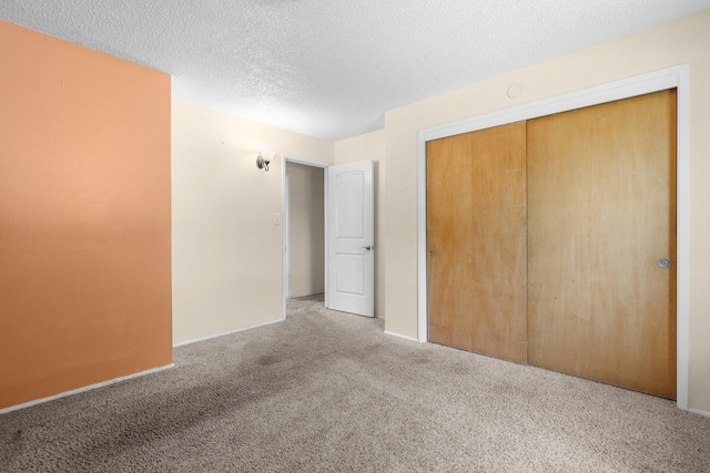 2048 Wilder Dr, Redding, CA 96001 - unfurnished bedroom featuring carpet flooring, a closet, and a textured ceiling