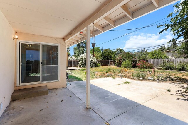 2048 Wilder Dr, Redding, CA 96001 - fenced backyard featuring a patio area