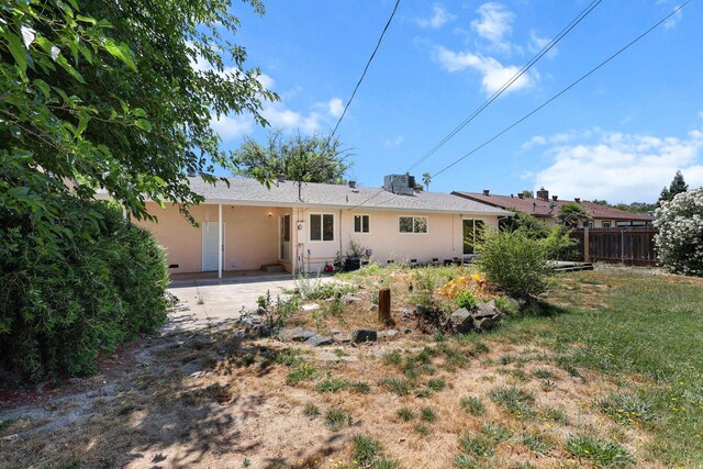 2048 Wilder Dr, Redding, CA 96001 - back of house with stucco siding and driveway