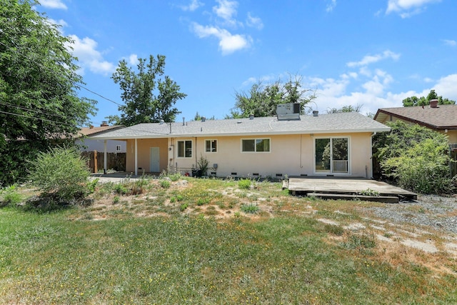 2048 Wilder Dr, Redding, CA 96001 - back of house with a wooden deck, a lawn, and crawl space