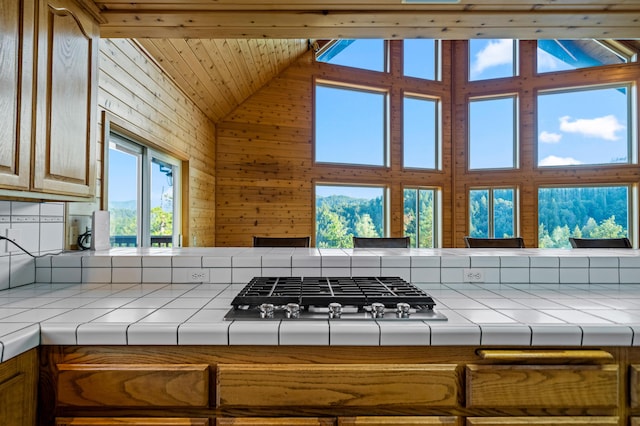 kitchen featuring tile countertops, wood ceiling, and lofted ceiling