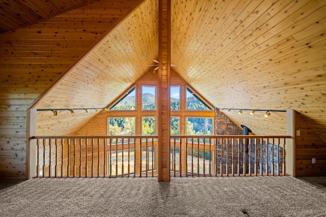 bonus room featuring carpet flooring, wooden walls, ceiling fan, and wooden ceiling