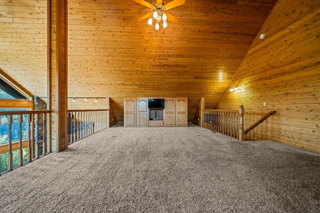 additional living space with carpet flooring, high vaulted ceiling, and ceiling fan