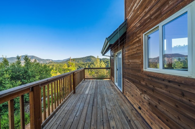 wooden deck with a mountain view