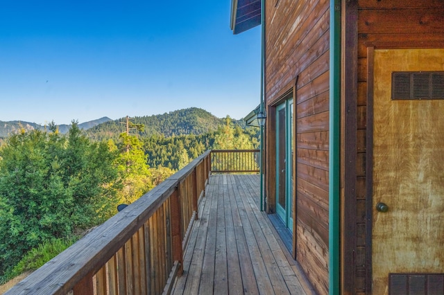 wooden terrace with a mountain view