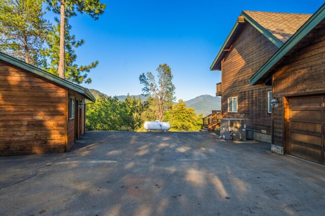 exterior space with a mountain view and a garage