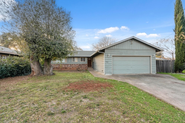 single story home with a front lawn and a garage