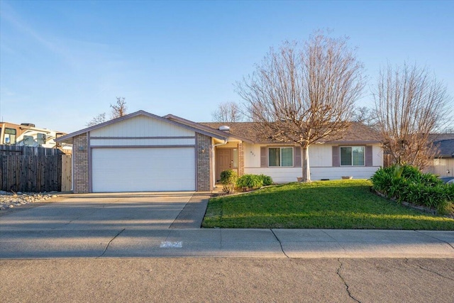 ranch-style home featuring a garage and a front lawn