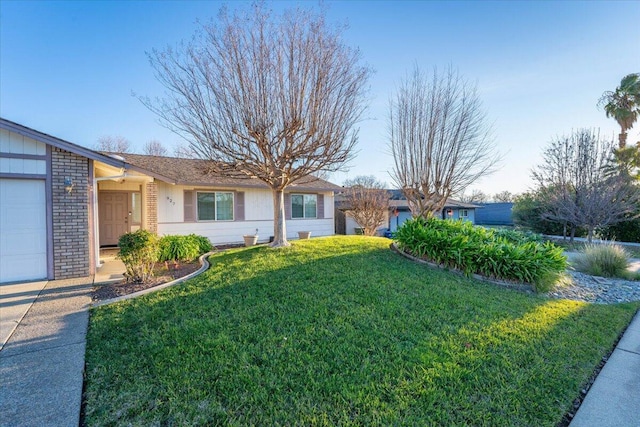 ranch-style house with a garage and a front lawn