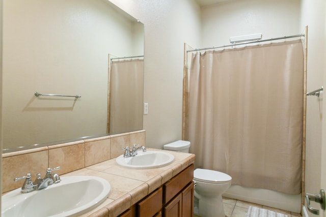 full bathroom featuring vanity, shower / bath combination with curtain, tile patterned flooring, toilet, and tasteful backsplash