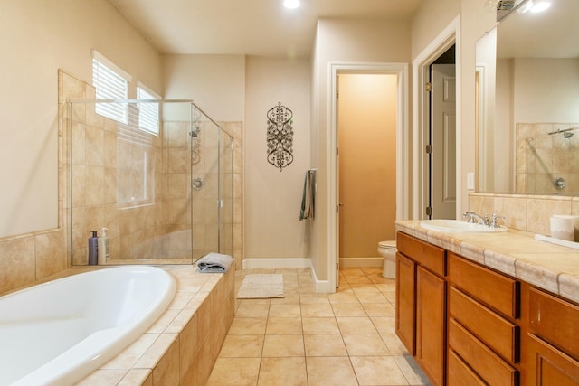 full bathroom featuring tile patterned flooring, vanity, toilet, and independent shower and bath