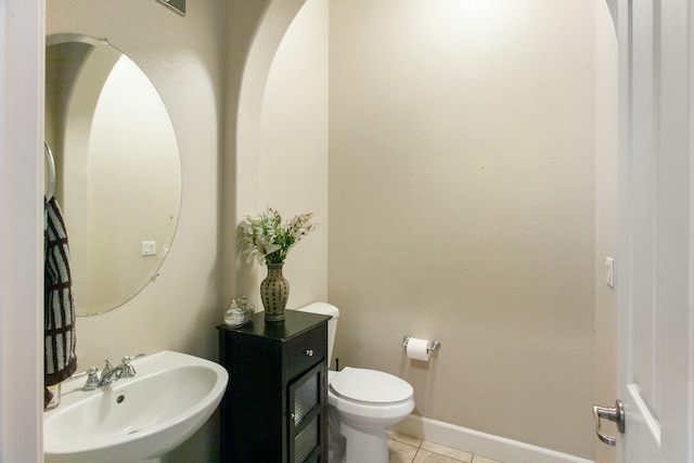 bathroom featuring tile patterned floors, sink, and toilet