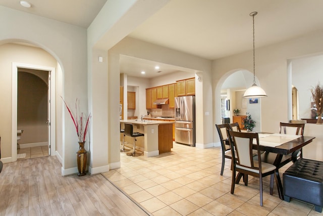 dining area featuring light wood-type flooring