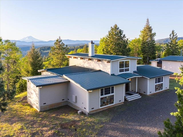 back of house featuring a mountain view