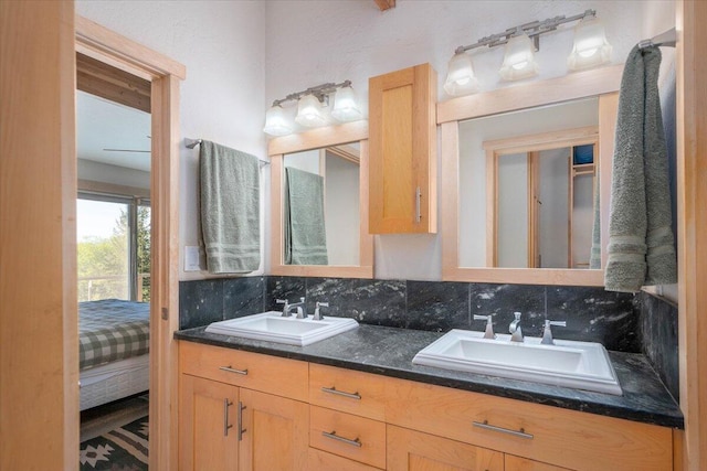 bathroom with vanity and backsplash