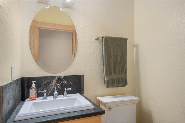 bathroom with backsplash and vanity