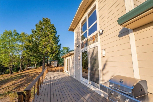 wooden terrace featuring grilling area