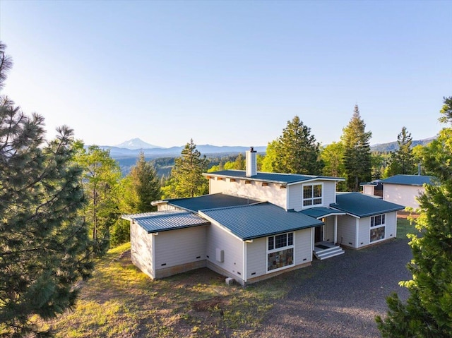 view of front of home featuring a mountain view