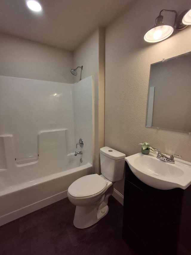 full bathroom featuring shower / bathing tub combination, vanity, and toilet