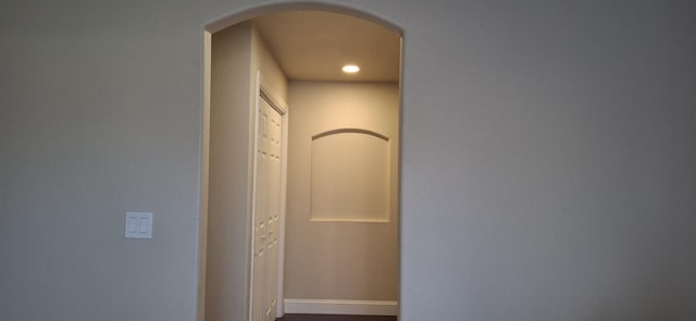 corridor featuring hardwood / wood-style floors