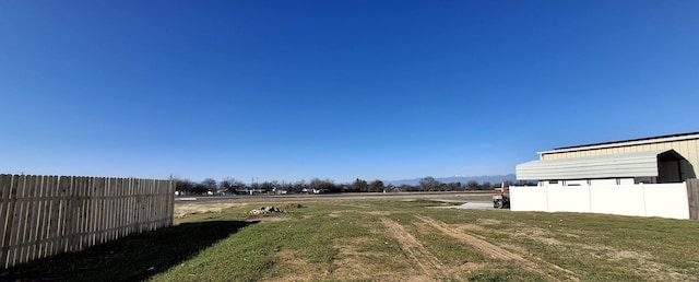 view of yard with a rural view