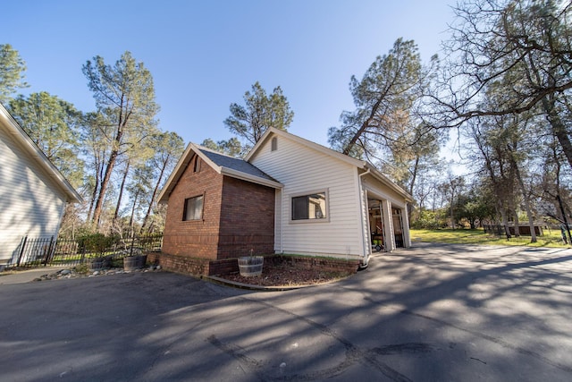 view of property exterior with a garage