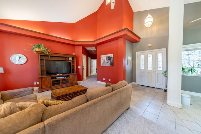 tiled living room with high vaulted ceiling